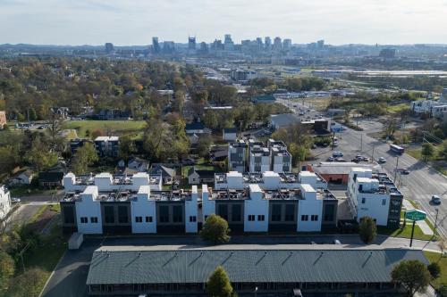 an aerial view of a building with a city in the background at Henley at The Lucy by Stay Local Nashville in Nashville