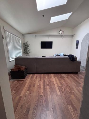 a living room with a couch and a flat screen tv at North Marysville Home in Marysville