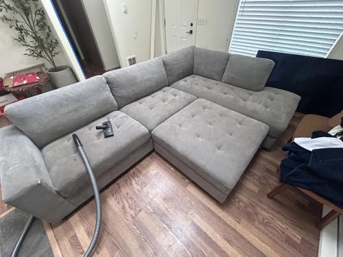 a grey couch in a living room with a hose at North Marysville Home in Marysville