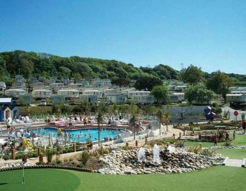 a view of a pool at a resort at Golden Sands Getaways Weymouth in Wyke Regis