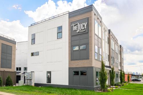 a large white building with a sign on it at Jocelyn at The Lucy by Stay Local Nashville in Nashville