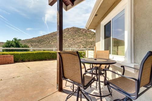 a patio with a table and chairs on a porch at Family Hideaway with Hillside Views in Temecula! in Temecula