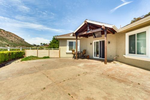 a patio in front of a house with a roof at Family Hideaway with Hillside Views in Temecula! in Temecula