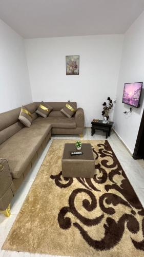 a living room with a couch and a table at Blue Bird House in Wadi Musa