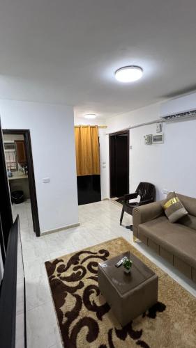 a living room with a couch and a chair at Blue Bird House in Wadi Musa