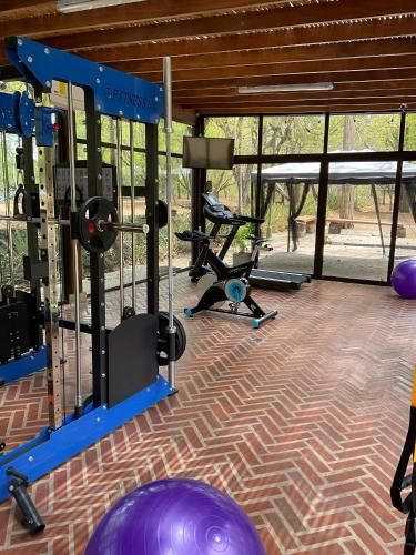 a gym with several exercise equipment in a room at CC Beach Front Papagayo All Inclusive in Papagayo, Guanacaste
