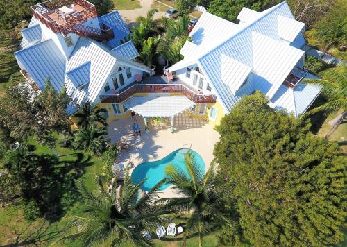 an overhead view of a large house with a swimming pool at Shangri-La Boutique Bed & Breakfast in West Bay