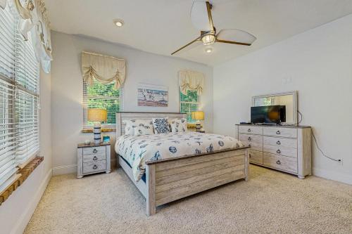 a bedroom with a bed and a flat screen tv at Restful Adventure On The Coast in Harrington