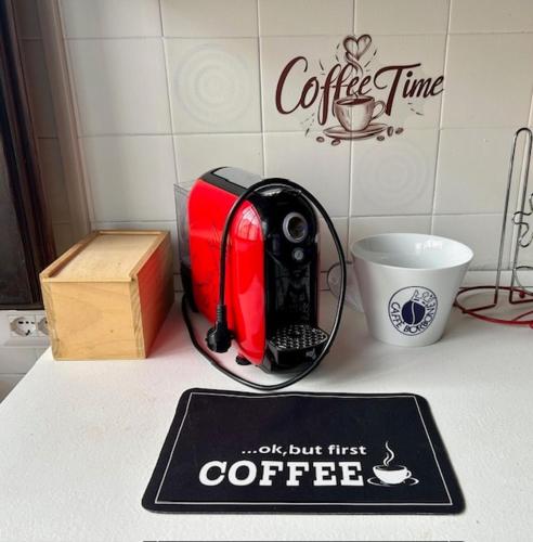 a toaster sitting on a counter next to a cup at Civico 31 in Terralba
