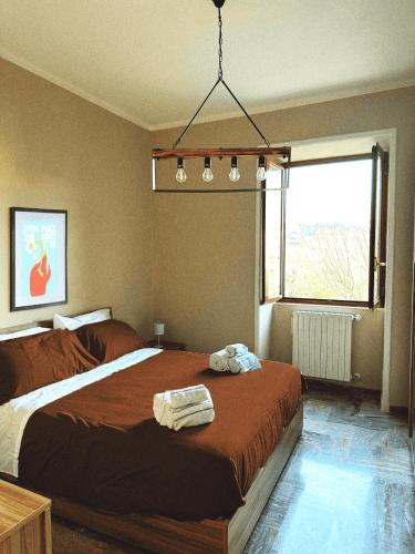 a bedroom with a large bed and a window at Terrazza Paradiso in Naples