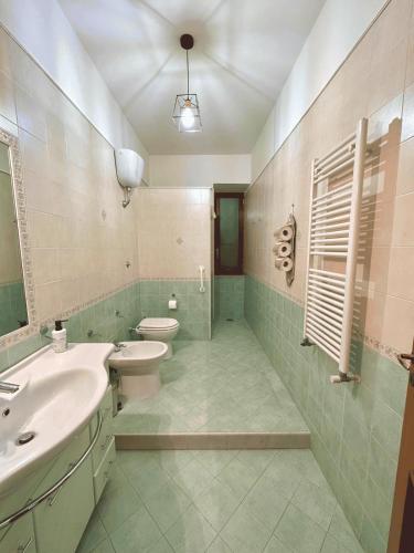 a bathroom with a toilet and a sink and a toilet at Terrazza Paradiso in Naples