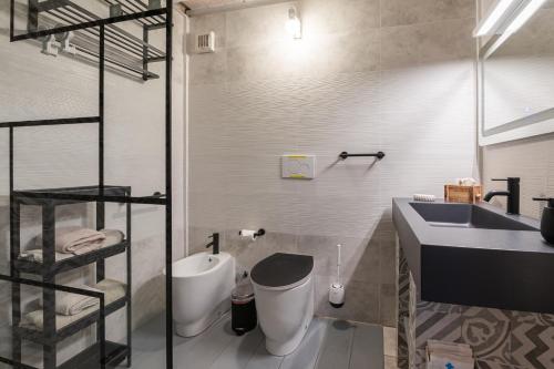 a bathroom with a sink and a toilet at Antico Podere Il Bugnolo in Poggibonsi