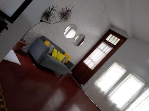 an overhead view of a living room with a couch and a door at Casa María Josefina in Rosario
