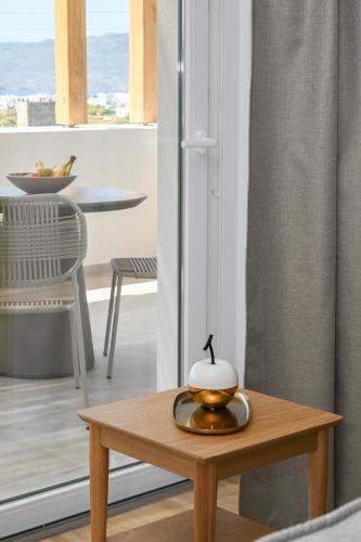 a coffee table with a bowl on top of it at Olive - Volia deluxe apartments in Adamas