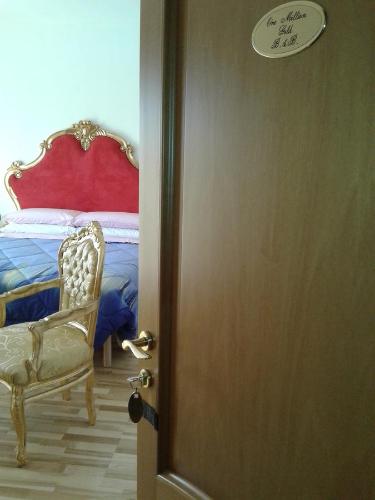 a door leading to a bedroom with a bed at One M in Borgarello