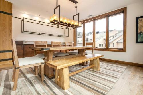 a dining room with a wooden table and chairs at Luxe 4 Bedroom Beaver Creek Lodge Condo With Ski In, Ski Out Access in Beaver Creek