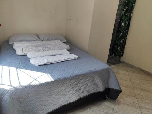 Postel nebo postele na pokoji v ubytování Refugio del Sol