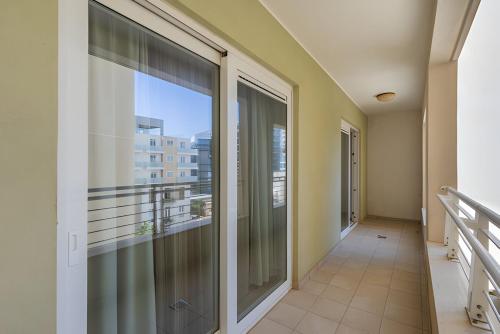 a balcony with a view of a building at Luxury Coastal Apartment with Panoramic Views S9 in Sliema