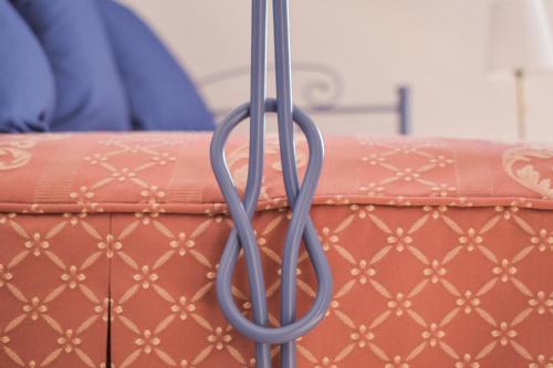 a close up of a pair of handles on a couch at Domus Aromatica in Assisi