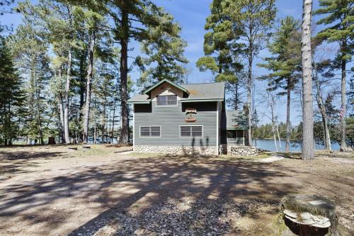 a house in the middle of a field at Stone Lake View in Manitowish Waters