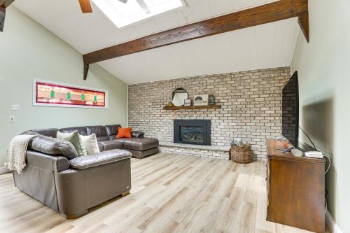 a living room with a couch and a fireplace at half Mi to Boat Ramp Lake Wallenpaupack Retreat! in Lakeville