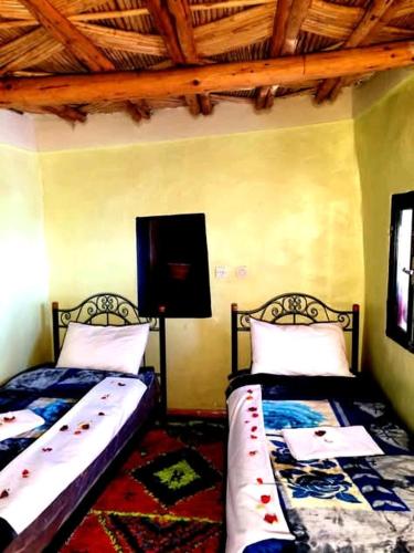 Cama o camas de una habitación en Gite Likemte Tachdirt