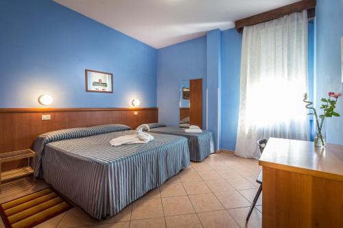 Postel nebo postele na pokoji v ubytování Hotel Real