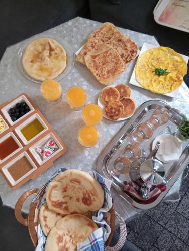 a table with a bunch of breakfast foods on it at Skb Sea House Taghazout in Taghazout