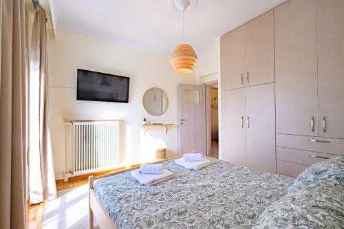 Ένα ή περισσότερα κρεβάτια σε δωμάτιο στο TheaSea