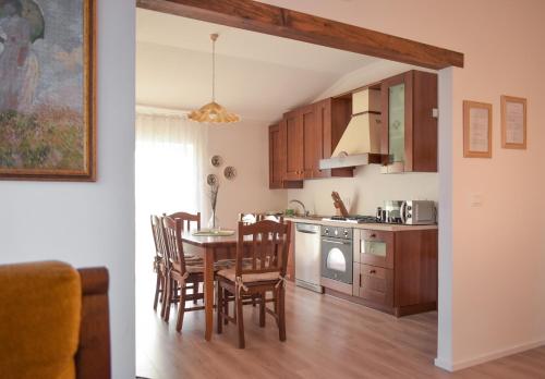 a kitchen and dining room with a table and chairs at Domus Aromatica in Assisi