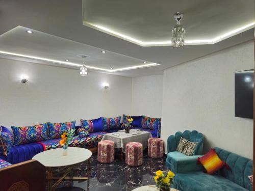 a living room with a couch and a table at casa españa center of medina in Tangier