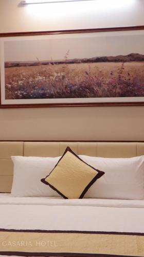 Ένα ή περισσότερα κρεβάτια σε δωμάτιο στο Casaria Hotel