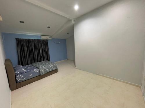 Ένα ή περισσότερα κρεβάτια σε δωμάτιο στο Aliita Homestay