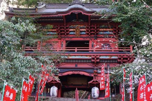 a red building with chinese flags in front of it at Hotel An no Ie - Vacation STAY 30037v in Ikaho