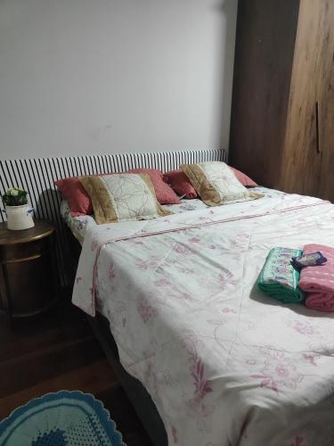 Ένα ή περισσότερα κρεβάτια σε δωμάτιο στο Pousada Canto dos pássaros