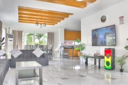 a living room with a couch and a table at Cozy Crib Saratoga in Tagaytay Midlands with Breakfast in Tagaytay