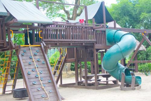 a playground with two slides at Cozy Crib Saratoga in Tagaytay Midlands with Breakfast in Tagaytay
