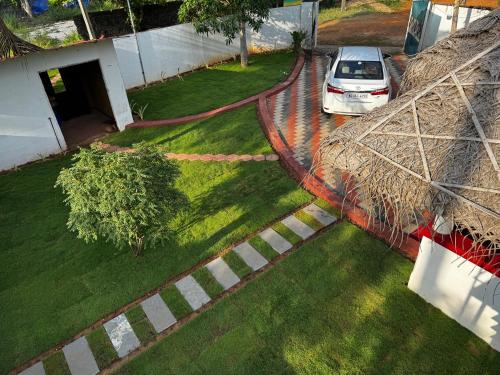 an aerial view of a car parked in a yard at Beach Heaven by Azure Heaven Holidays Pvt ltd in Mararikulam