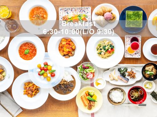 a table with plates of food on it at Mitsui Garden Hotel Sendai - Reopening on June 14 in Sendai