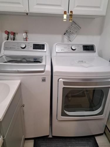a kitchen with two ovens and a stove at Fun Home in Pocono with Gameroom-Firpit-BBQ Grill-TV and AC in all rooms in Tobyhanna