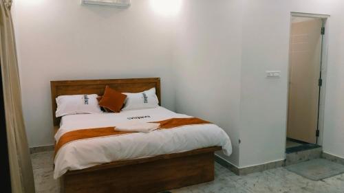Postel nebo postele na pokoji v ubytování Hotel Banaras Spirits