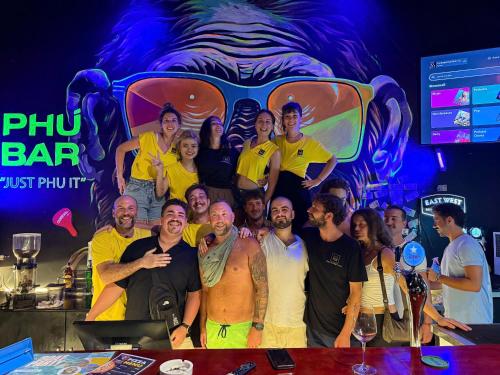 a group of people posing for a picture in a bar at Phu House in Phu Quoc