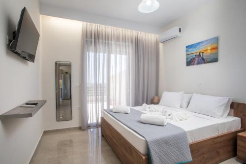 Кровать или кровати в номере Twin Villas Gennadi