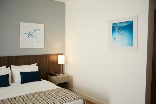 Postel nebo postele na pokoji v ubytování Tulip Inn Itaguai