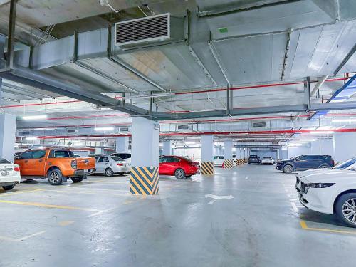a parking garage with many cars parked in it at Châu Giang Homestay, Nera Garden Huế in Thôn Văn Dương