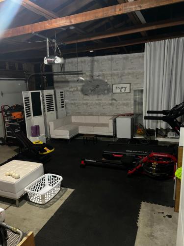 a living room with a couch and a table at Spacious Home Steps from Huge Park and Outdoor Fun in San Jose