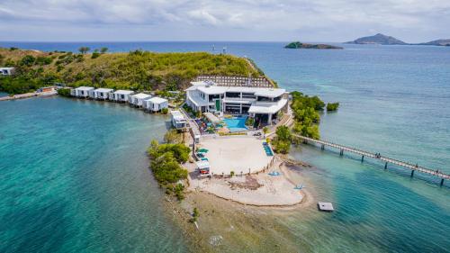 an aerial view of a resort on an island in the water at Loloata Island Resort in Loloata Island