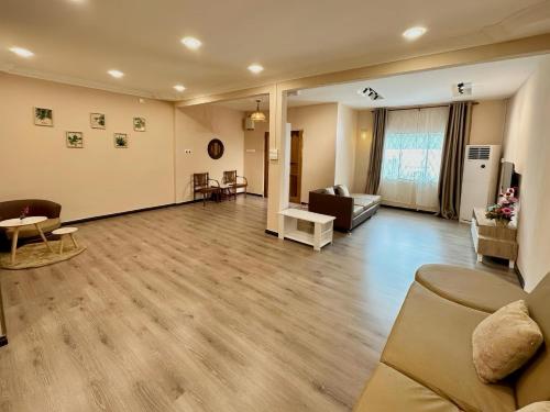 a living room with a couch and a table at ANG LEE HOLIDAY HOME 2 in Semporna