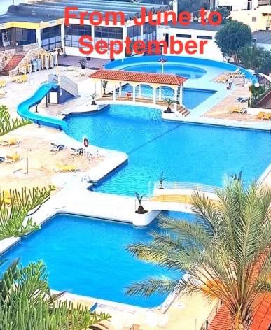 an aerial view of a swimming pool in a resort at Laukamao Praia Da Rocha in Portimão