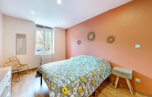 a bedroom with a bed and two mirrors on the wall at Amazing Home In Haybes With Wifi in Haybes